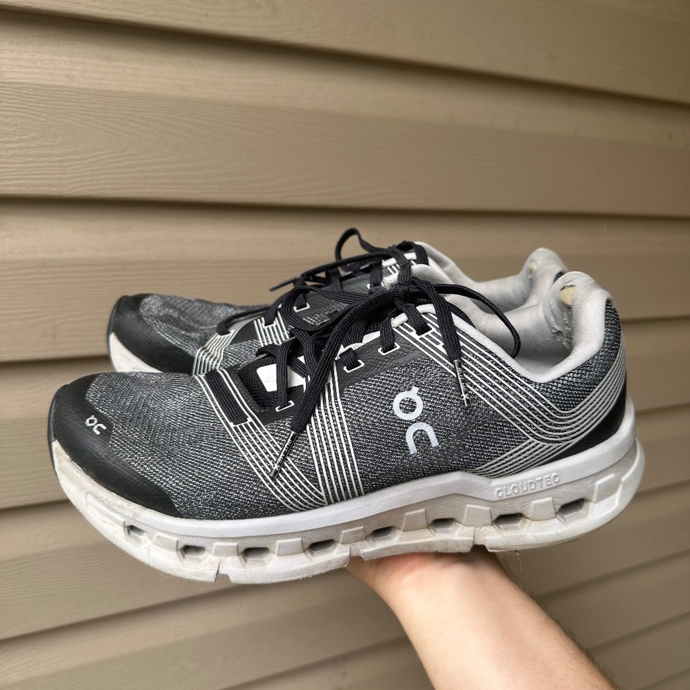 Black and gray On Cloud running shoes